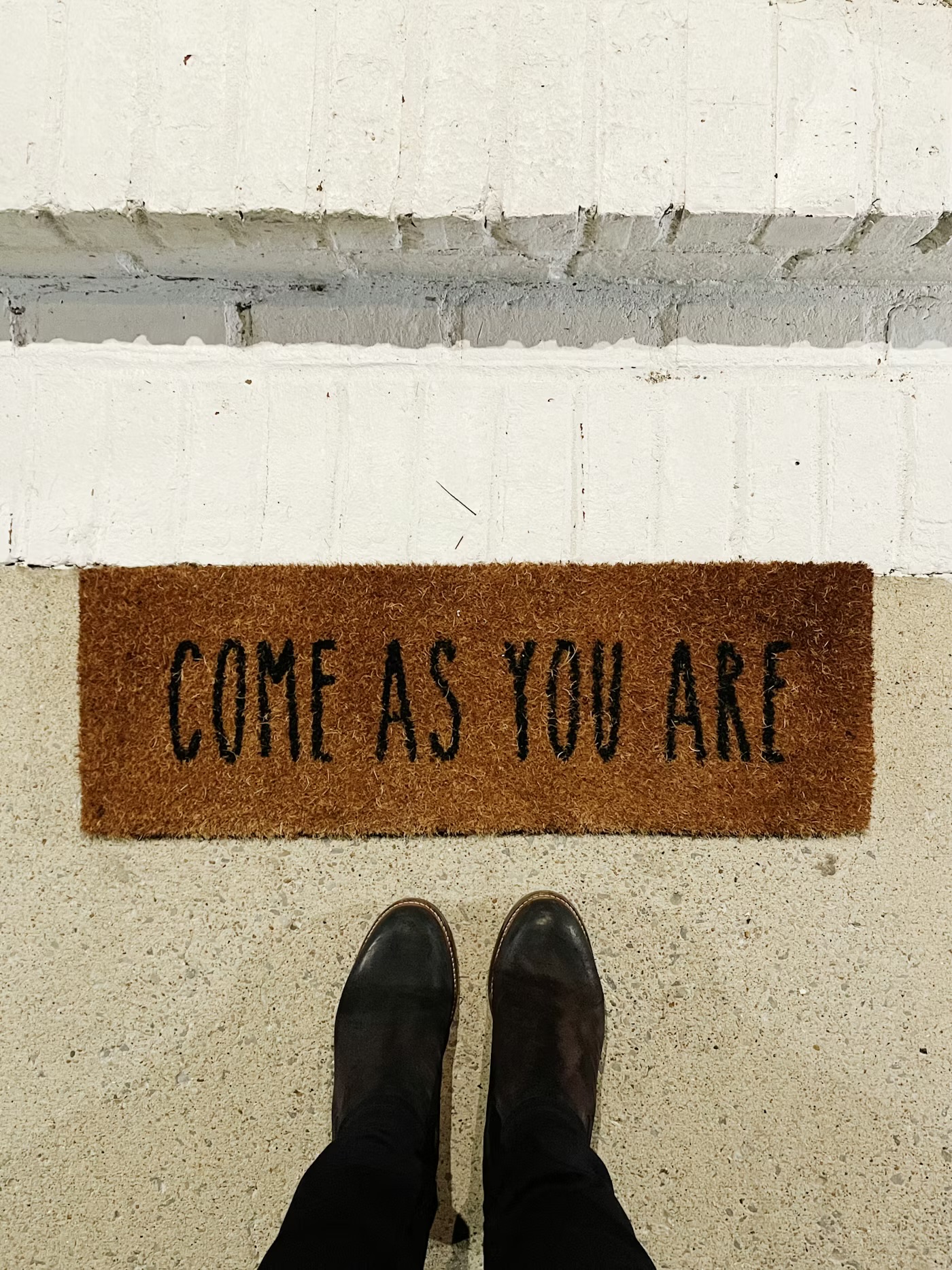 A doormat that reads Come As You Are