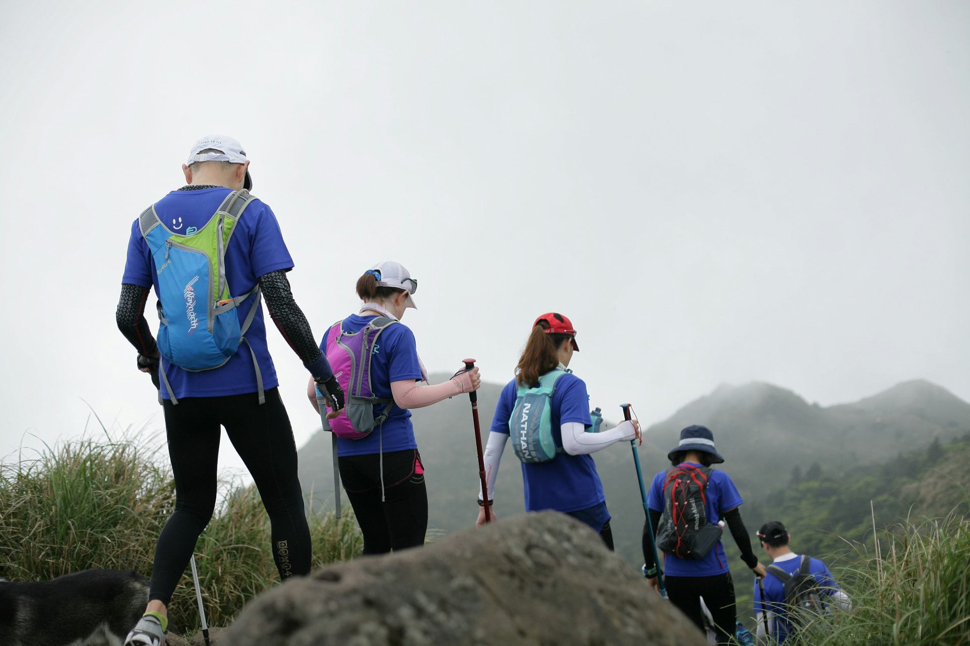 Hikers on a trail through the mountains